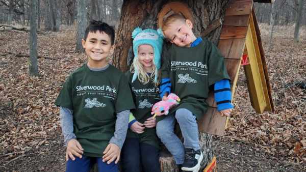 This is a picture of three children with Silverwood Park t-shirts.