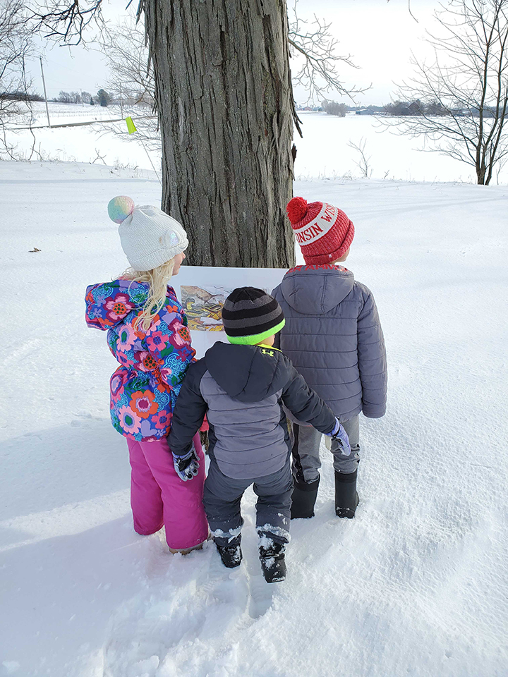 Rita Fox's grandchildren on "Under in the Mud" story walk