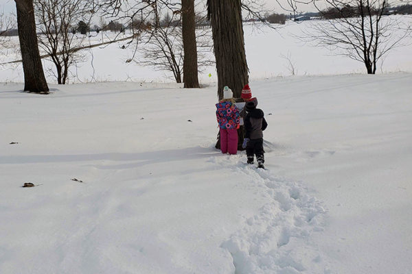 Rita Fox's grandchildren on "Under in the Mud" story walk