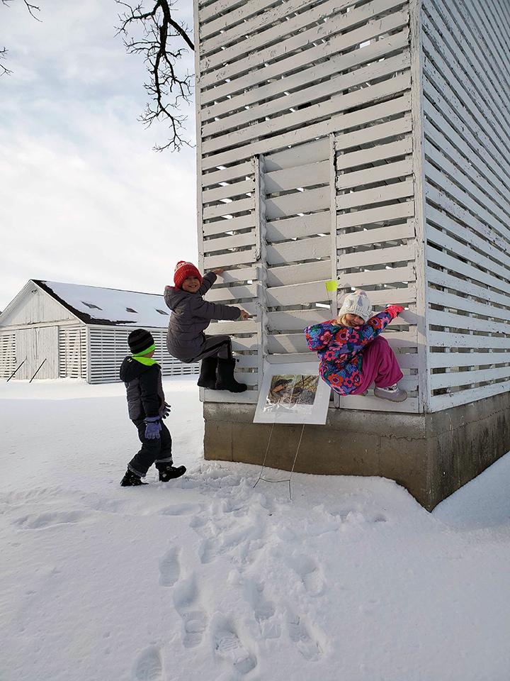 Rita Fox's grandkids climb the corn crib