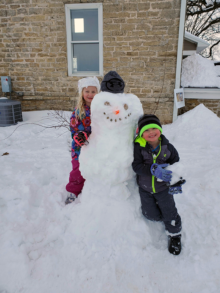 Rita Fox's grandchildren make a snowman