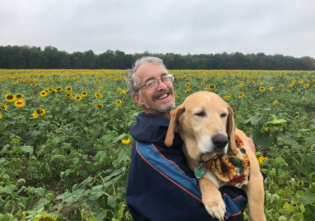 This is a picture of John Peck, and his dog, of Yellow Dog Produce at Silverwood Park